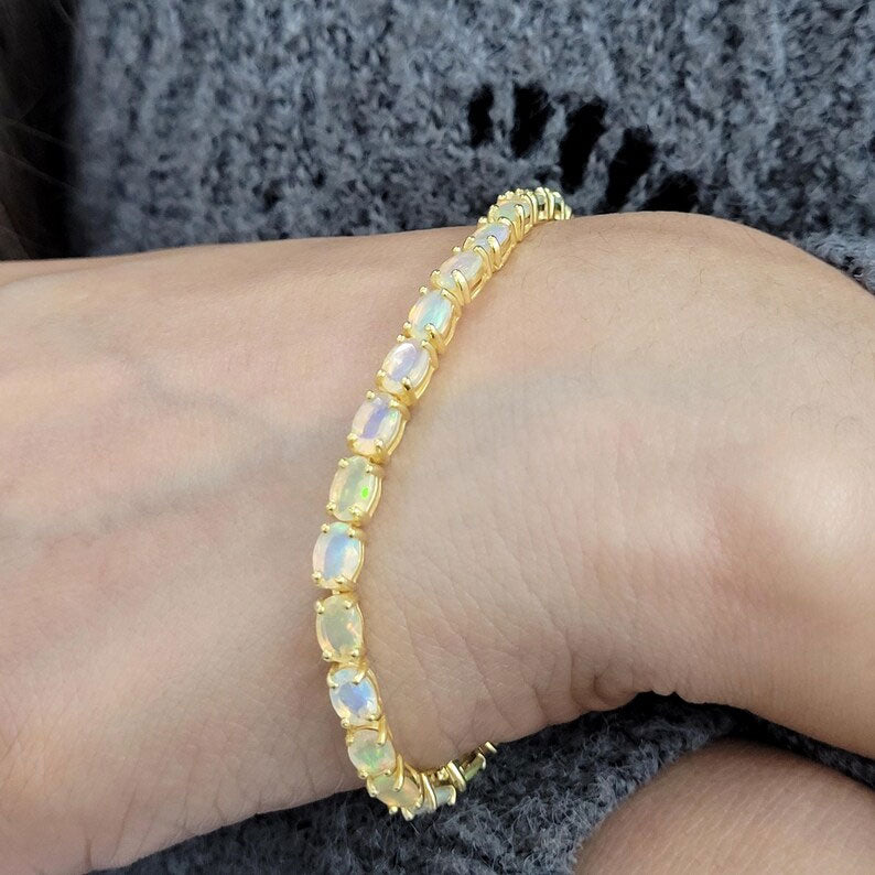 2025 Trendy 925 Sterling Silver  Gold Plated Bangles 5X7MM Oval Shaped Ethiopian Opal Gemstone Prong Setting For Anniversary Gift Women or Men Jewelry For Her