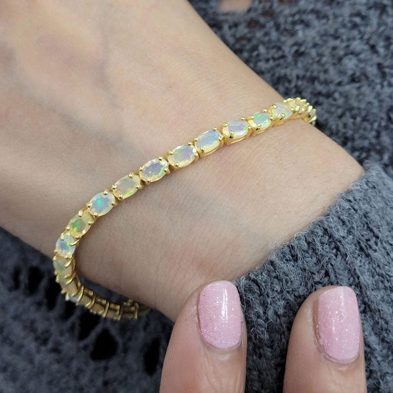 2025 Trendy 925 Sterling Silver  Gold Plated Bangles 5X7MM Oval Shaped Ethiopian Opal Gemstone Prong Setting For Anniversary Gift Women or Men Jewelry For Her