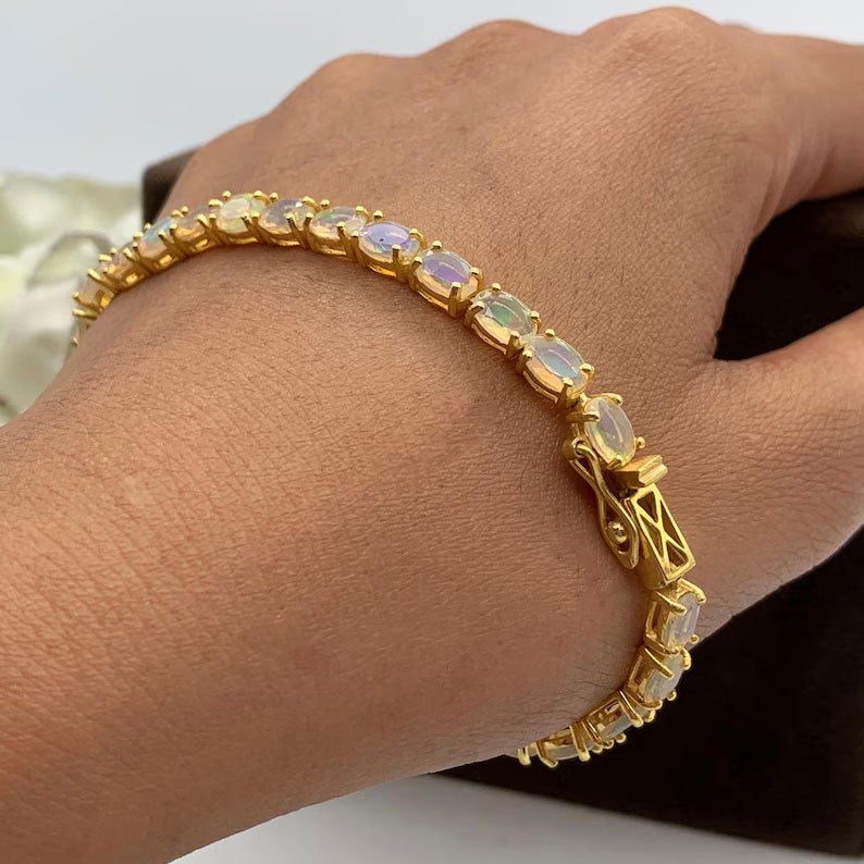 2025 Trendy 925 Sterling Silver  Gold Plated Bangles 5X7MM Oval Shaped Ethiopian Opal Gemstone Prong Setting For Anniversary Gift Women or Men Jewelry For Her