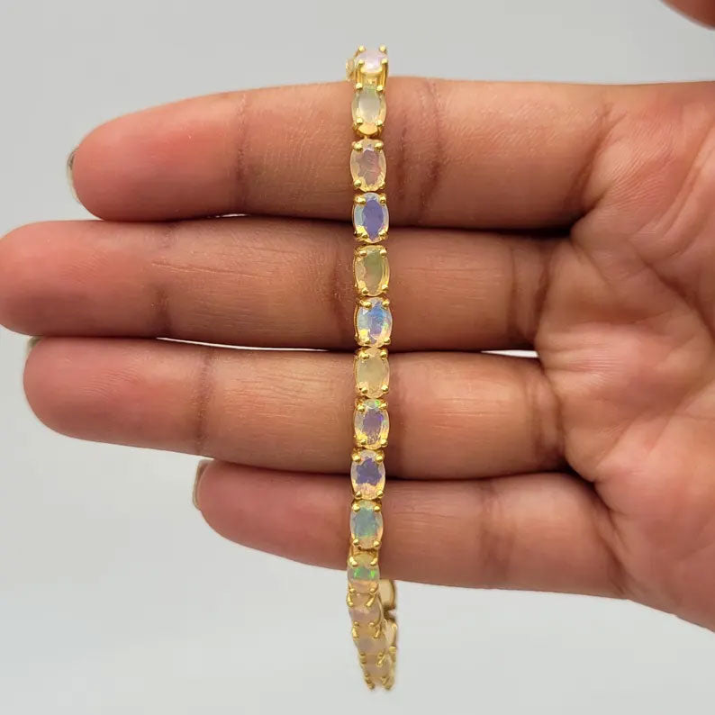 2025 Trendy 925 Sterling Silver  Gold Plated Bangles 5X7MM Oval Shaped Ethiopian Opal Gemstone Prong Setting For Anniversary Gift Women or Men Jewelry For Her